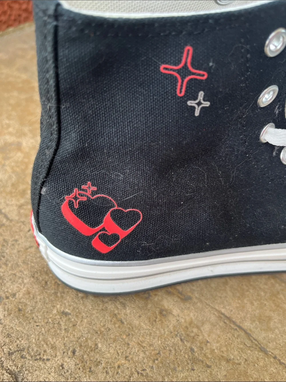 Converse Kids Black High-Top Sneakers with White Soles and Red Heart Details
